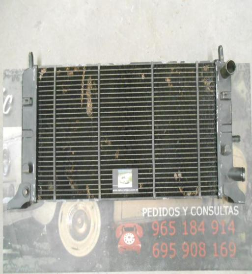RAM87P4 RADIADOR MOTOR FORD ESCORT MKIV ORION II 1.1/1.3 COBRE MEDIDA 600x305x38mm MONTAÑA